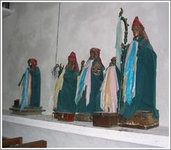 Christian figures wearing Mayan clothes in a Catholic church in Santiago.
