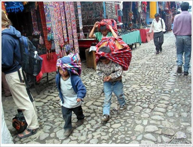 Boys with bags on head.