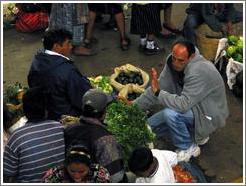 Bargaining for food at the market.