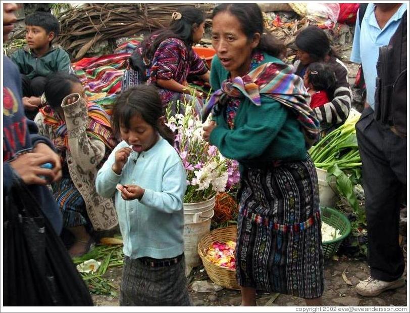 Girl and woman, food market.