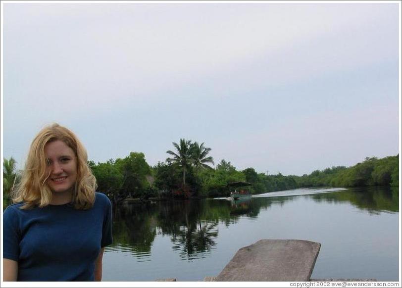 Eve on boat in the mangrove swamp.