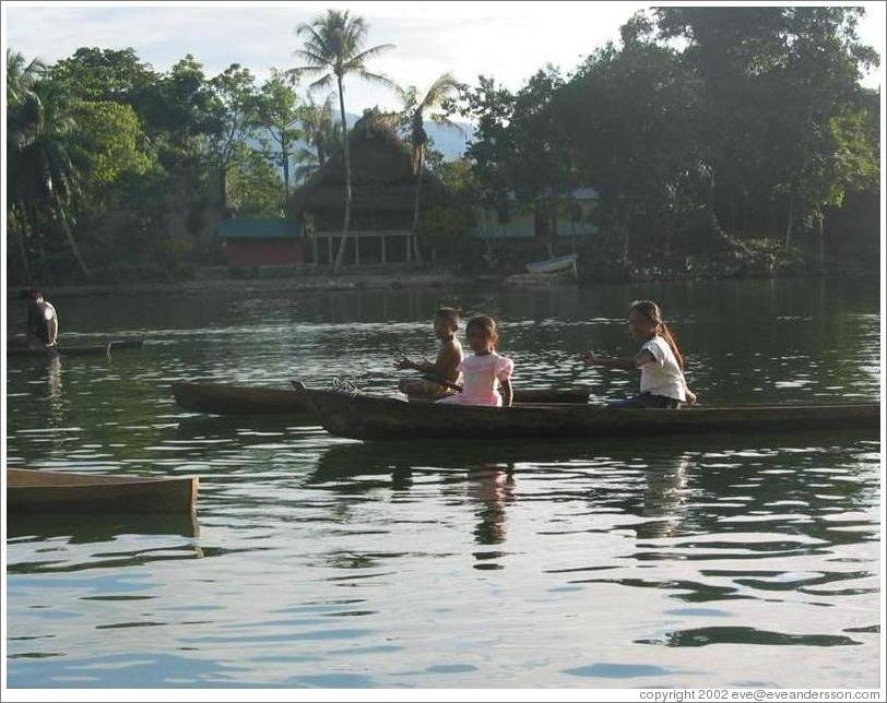 Three girls in boat.