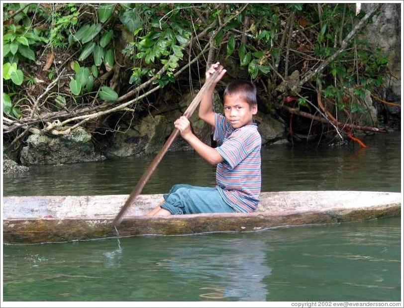 Boy in canoe.