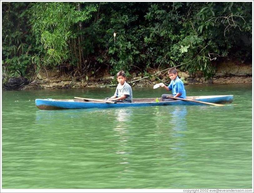 Boys in canoe.