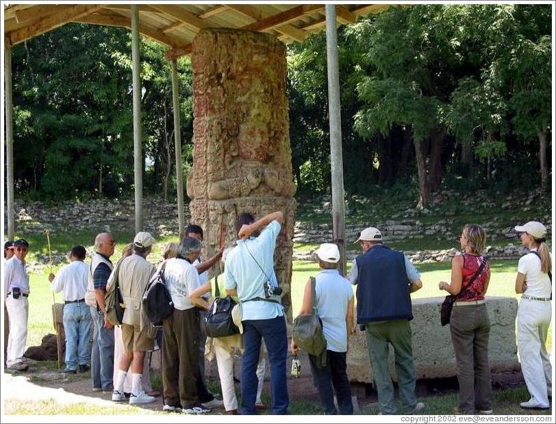 Tourists crowd around Estela B.  Gran Plaza.