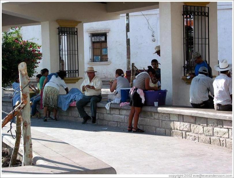 Parque Central.  Women washing, men sitting.