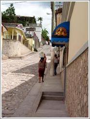 Woman balancing basket.