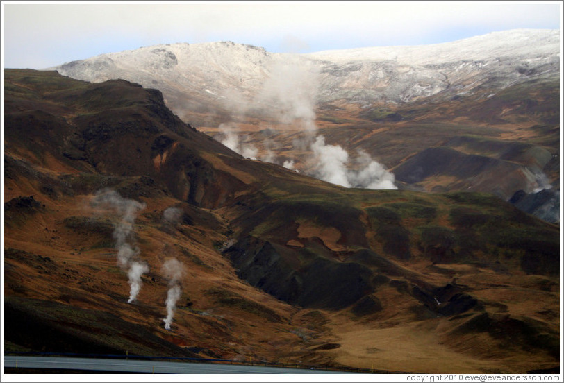 Geothermal steam rising from the ground.