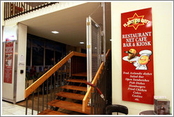 Restaurant sign depicting an animal's head on a platter.  BSI bus station.