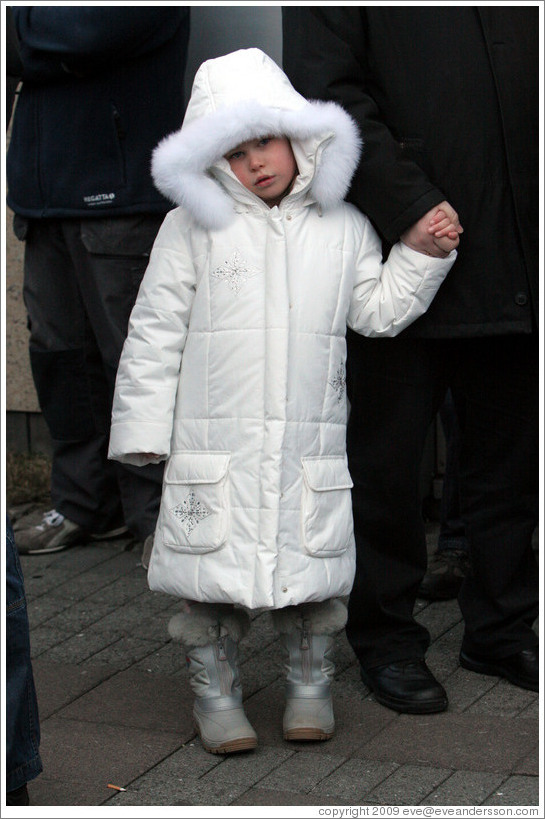 Girl in white coat.