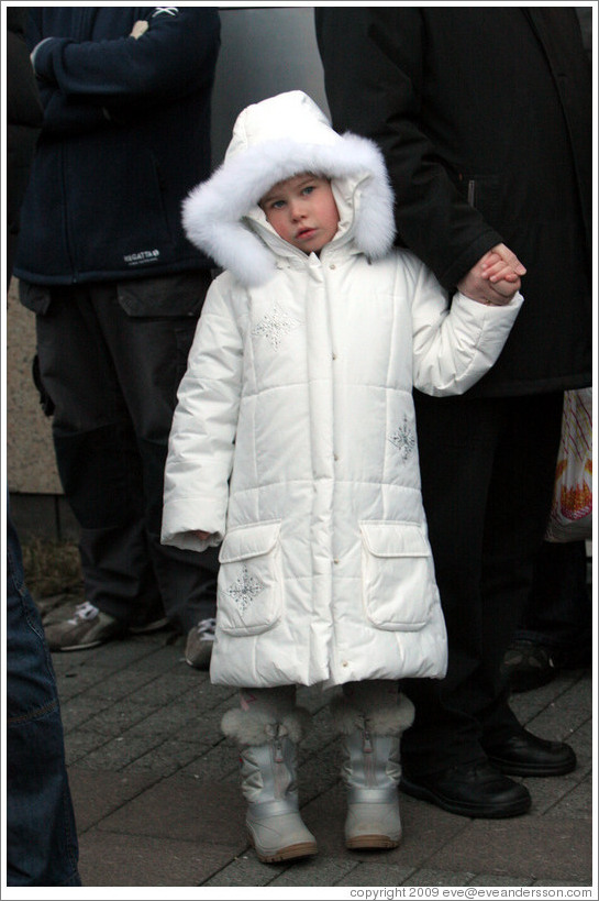 Girl in white coat.