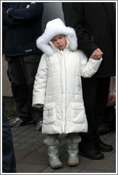 Girl in white coat.