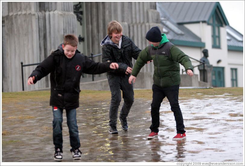 Children sliding on ice.