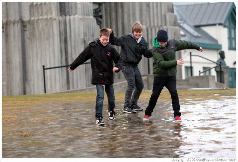 Children sliding on ice.