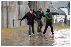 Children sliding on ice.