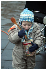 Protest in Reykjavik.  Child with tin and spoon.