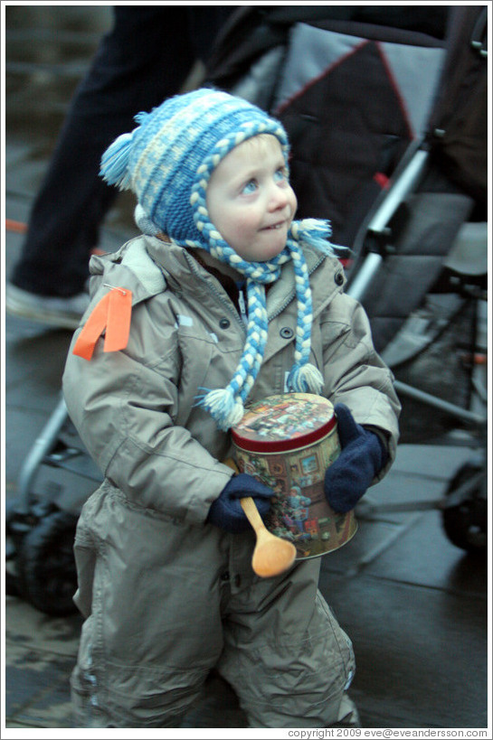 Protest in Reykjavik.  Child with tin and spoon.