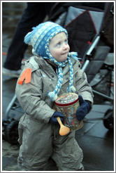 Protest in Reykjavik.  Child with tin and spoon.