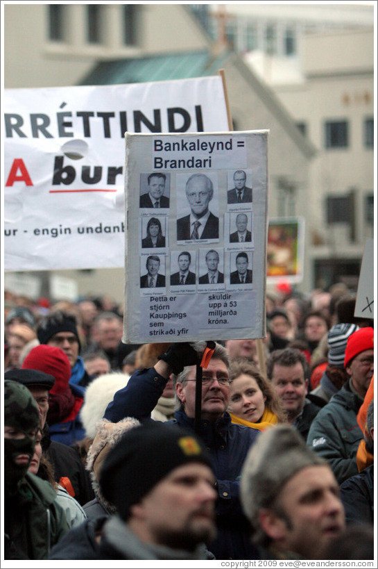 Reykjavik protest. The sign says "Bankaleynd = Brandari; ?tta er stj?Kaup?ings sem strika?fir; skuldir upp ?3 milljar?r? ("Bank Secrecy = A joke; This is the board of Kaupthing which erased debts amounting to 53 billion kronur").