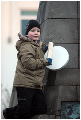 Reykjavik protest. Boy banging drum.