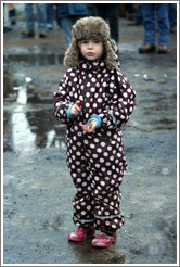 Girl in polka dotted outfit at Reykjavik protest.