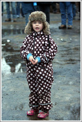 Girl in polka dotted outfit at Reykjavik protest.