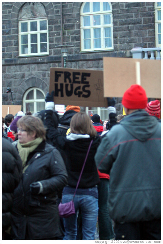 Reykjavik protest.  "Free Hugs" sign.