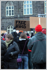 Reykjavik protest.  "Free Hugs" sign.