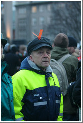 Reykjavik protest.  Man with orange ribbon signifying peaceful protest.