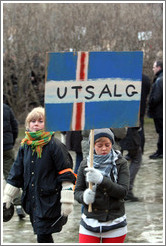 Reykjavik protest.  The sign depicts an Icelandic flag with "UTSALG" (the Norwegian word for "SALE") on it, implying Iceland is for sale.