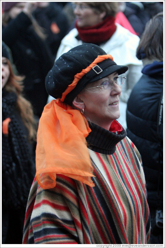 Reykjavik protest.  Woman with orange scarf symbolizing peaceful protest.