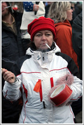 Reykjavik protest.  Smoking woman banging a pot.