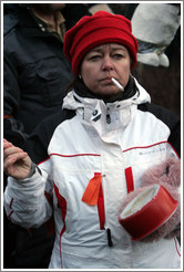 Reykjavik protest.  Smoking woman banging a pot.