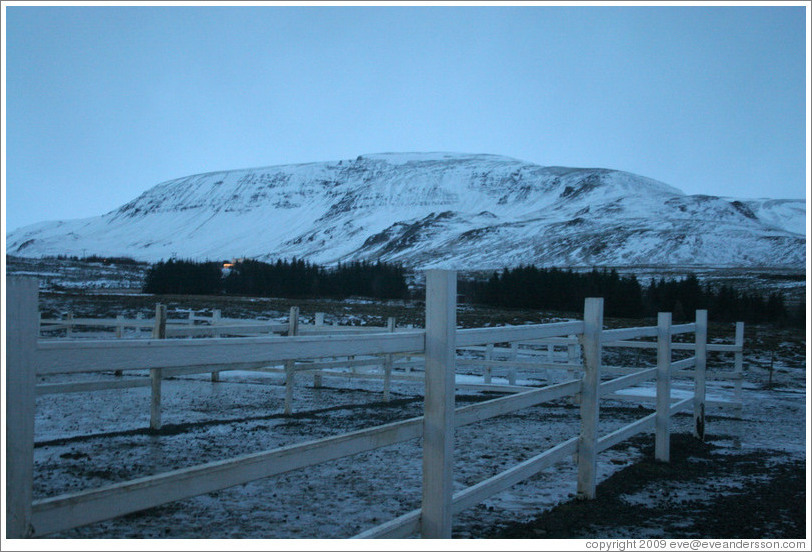 Snow-covered butte.
