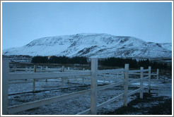 Snow-covered butte.