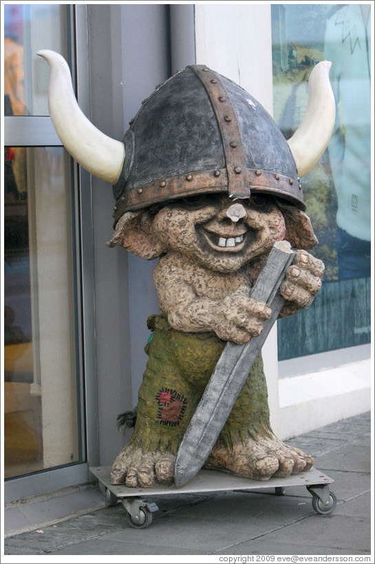 Viking troll outside storefront.