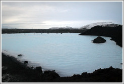 Volcanic terrain and water containing silica sediment near the Blue Lagoon.