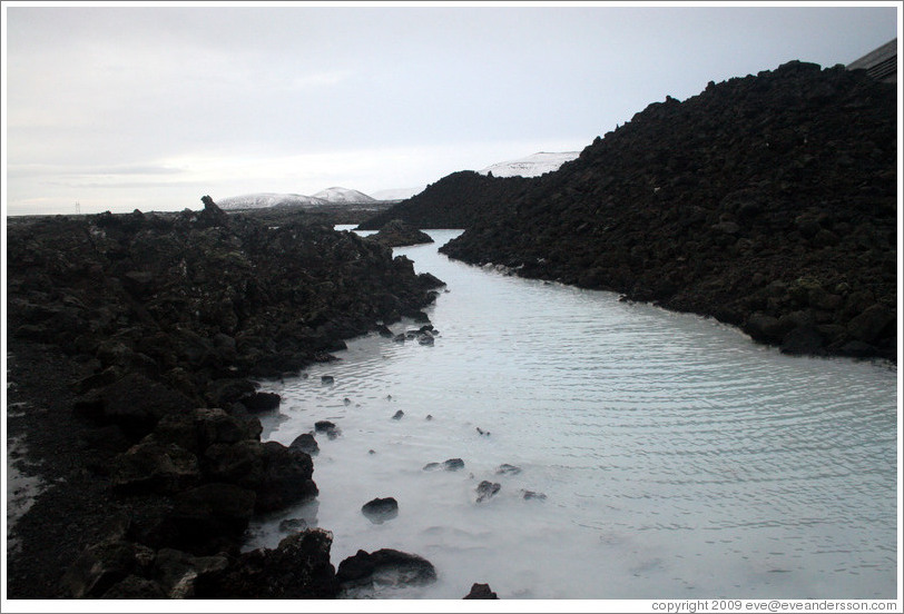 Volcanic terrain and water containing silica sediment near the Blue Lagoon.

