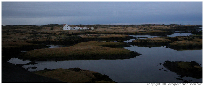 White house on Iceland's volcanic coast.