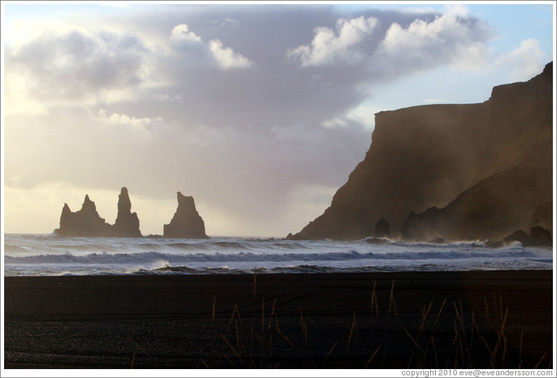 Reynisdrangar, volcanic rock shooting from the ocean, under the mountain Reynisfjall.