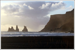 Reynisdrangar, volcanic rock shooting from the ocean, under the mountain Reynisfjall.