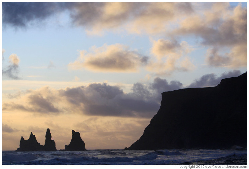 Reynisdrangar, volcanic rock shooting from the ocean, under the mountain Reynisfjall. 