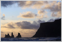 Reynisdrangar, volcanic rock shooting from the ocean, under the mountain Reynisfjall. 