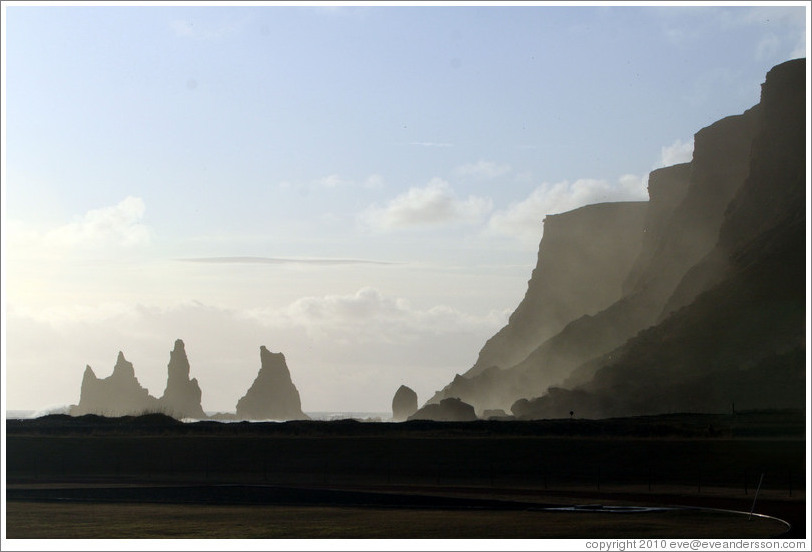 Reynisdrangar, volcanic rock shooting from the ocean, under the mountain Reynisfjall. 