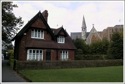 A cottage in Stephen's Green. Behind it is an old, beautiful church.