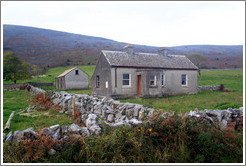 House with stone fence.