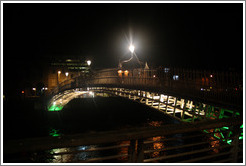 The Ha'penny Bridge over the River Liffey at night.