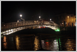 The Ha'penny Bridge over the River Liffey at night.
