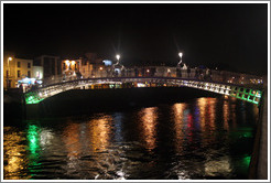 The Ha'penny Bridge over the River Liffey at night.