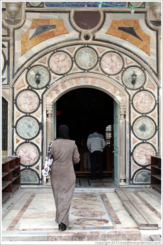 Woman entering Al-Jazzar Mosque.  Old town Akko.